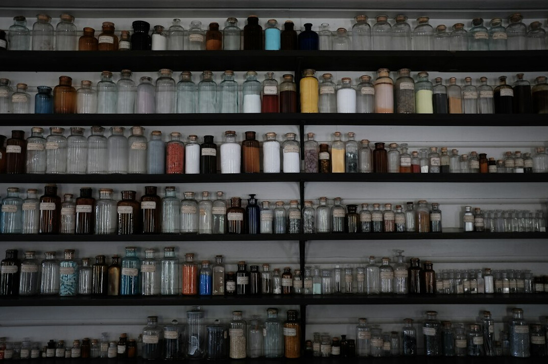 Organized pharmacy shelf with medicine boxes