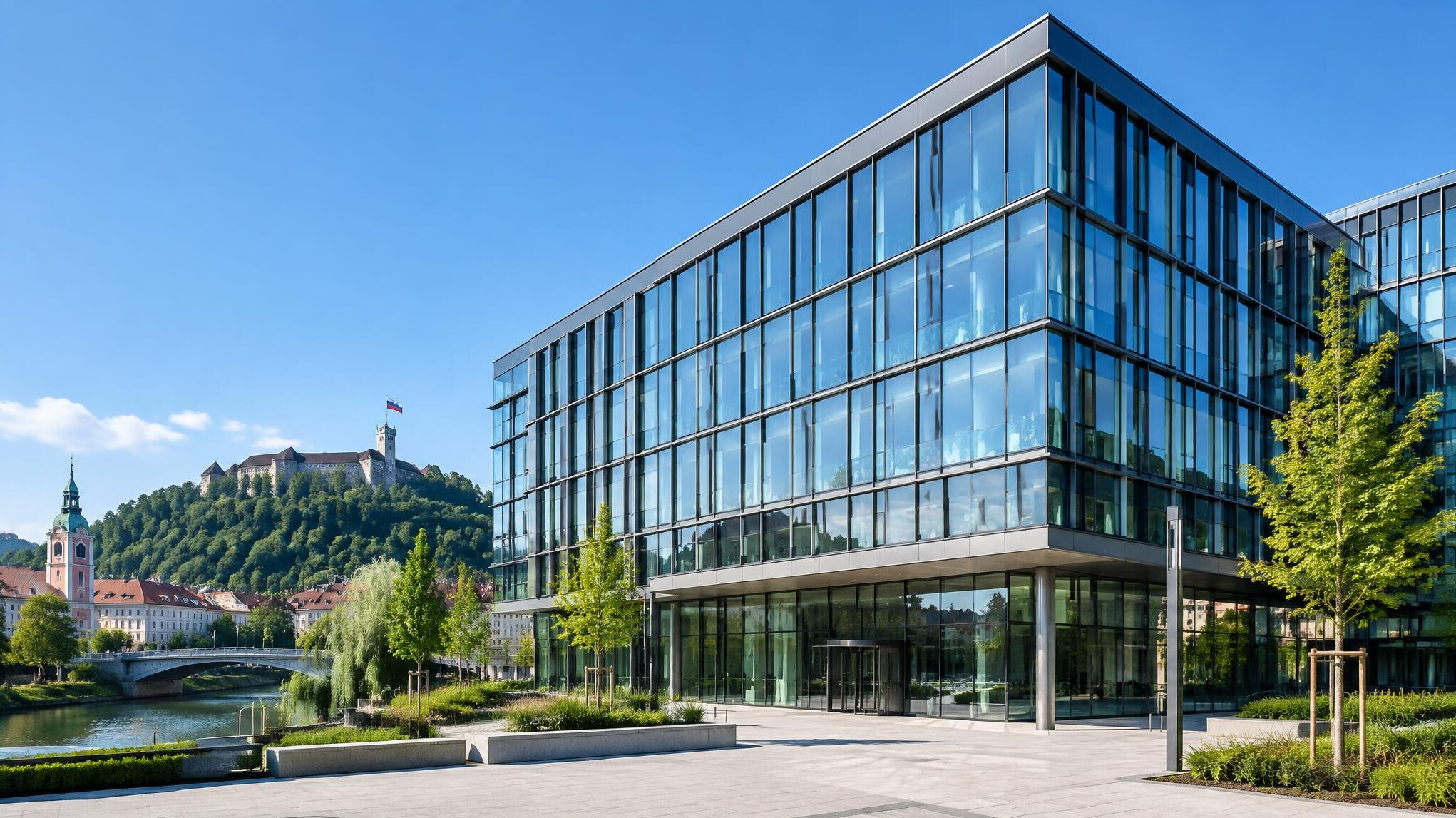 Modern glass office building exterior under blue sky
