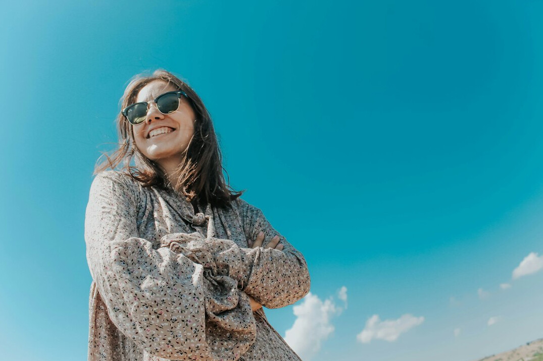 Smiling woman confident about her health insurance